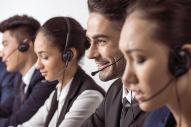 Call center operators in headsets  clipart
