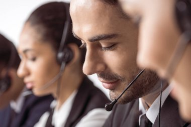 Call center operators in headsets  clipart