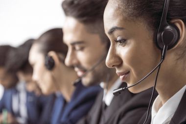 Call center operators in headsets  clipart