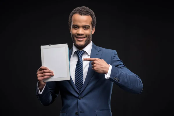 Businessman using digital tablet — Free Stock Photo