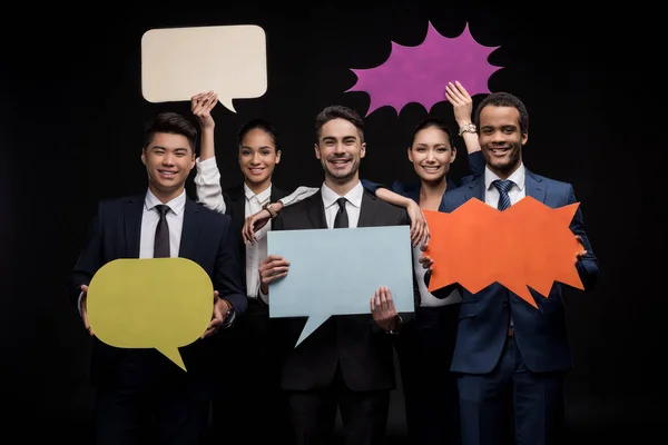 Empresarios con burbujas de habla en blanco — Foto de Stock