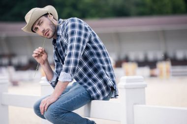 Handsome man in cowboy hat  clipart