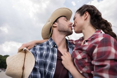 young affectionate cowboy style couple clipart