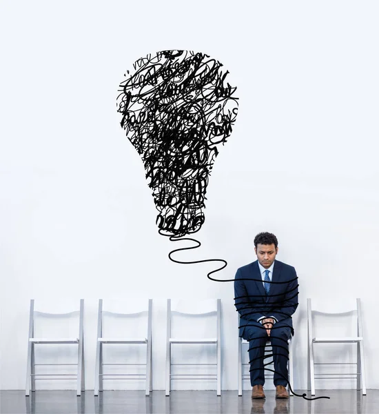 Businessman sitting on chair — Stock Photo, Image