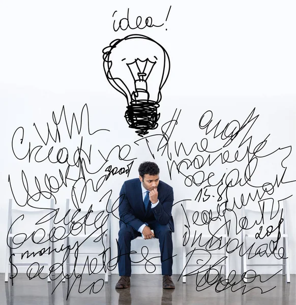 Businessman sitting on chair — Stock Photo, Image