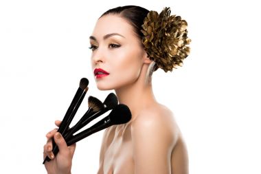 Woman holding makeup brushes  clipart