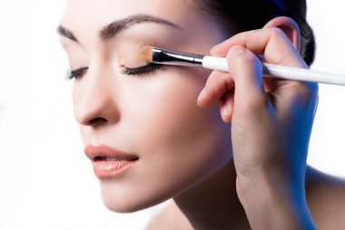Makeup artist using brush clipart