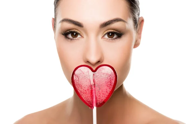 Woman with heart shaped lollipop — Stock Photo, Image