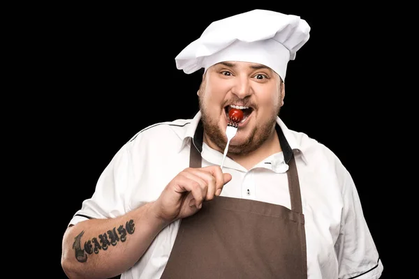 Chef holding tomato on fork — Stock Photo, Image