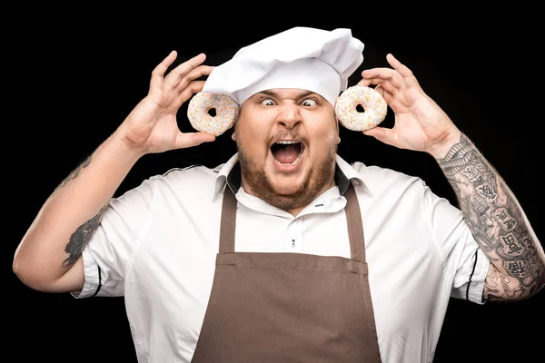 Koch hält Donuts in der Hand — Stockfoto