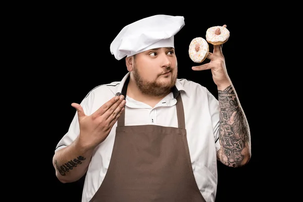 Chef holding doughnuts — Stock Photo, Image