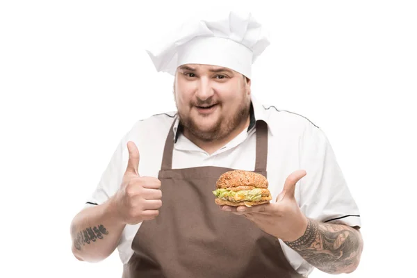 Cooker with tasty burger — Stock Photo, Image