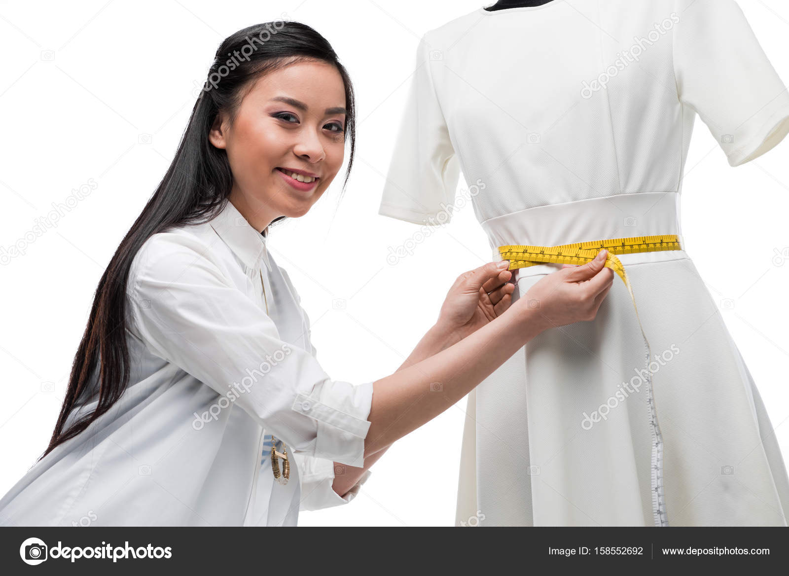 Fashion designer measuring dress on dummy — Stock Photo © DmitryPoch