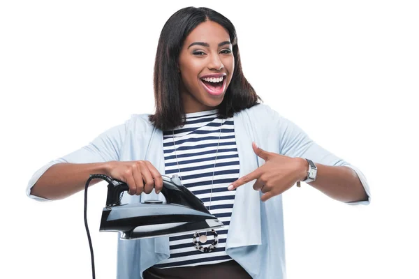 Young woman holding iron — Stock Photo, Image