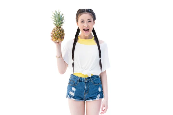 Asian woman with pineapple — Free Stock Photo