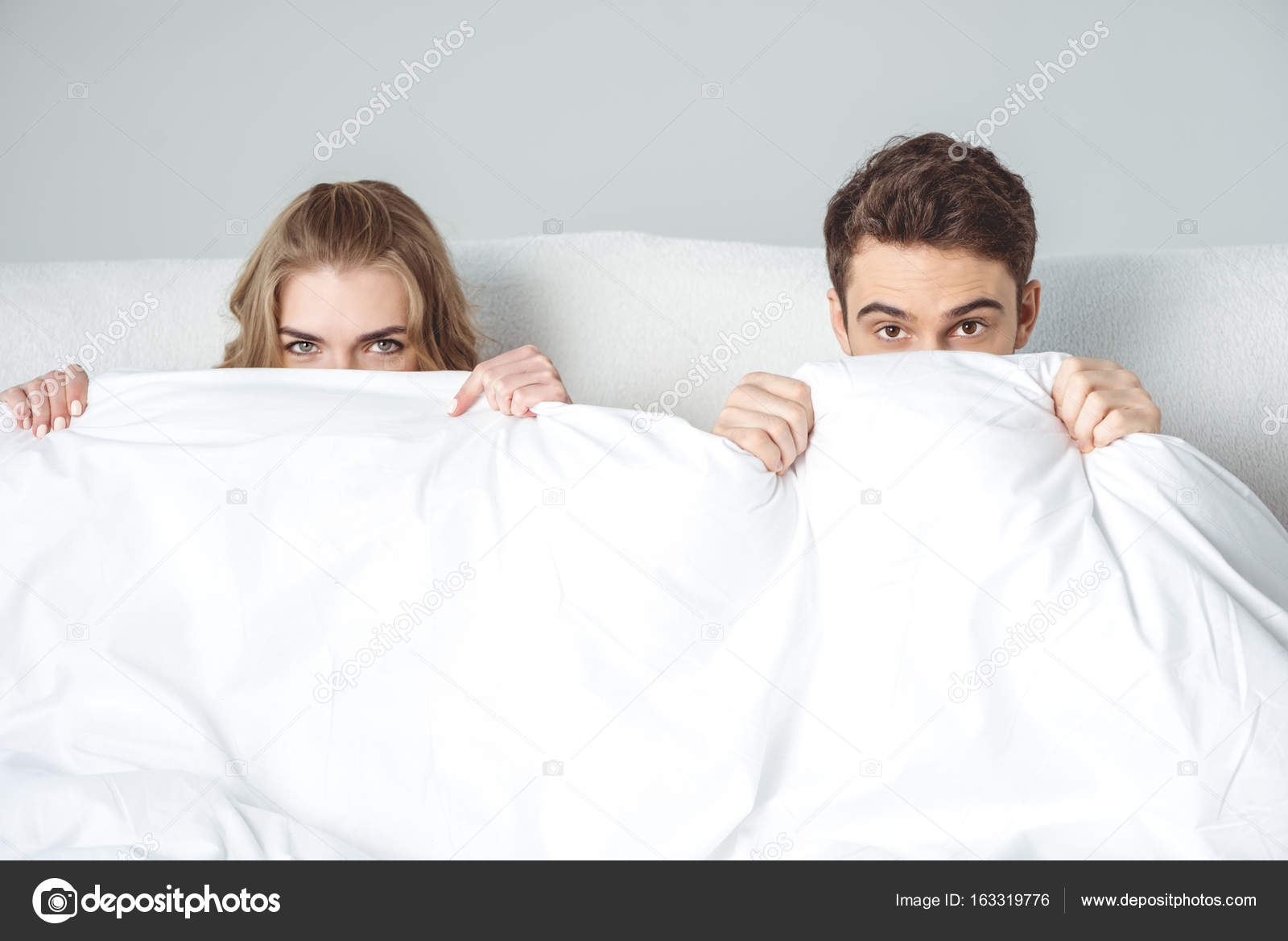 Couple lying in bed — Stock Photo © DmitryPoch 163319776
