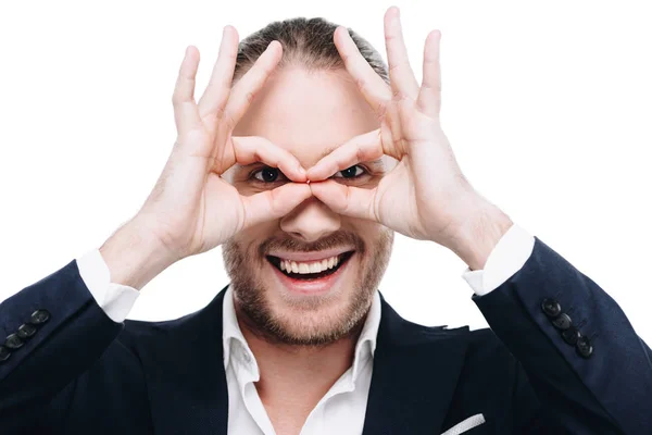 Geschäftsmann macht Brillen-Geste — kostenloses Stockfoto