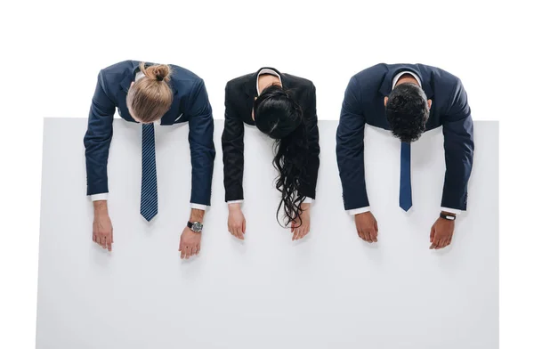 Exhausted businesspeople with empty board — Stock Photo, Image