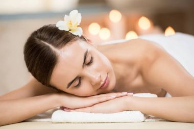 woman relaxing in spa salon clipart