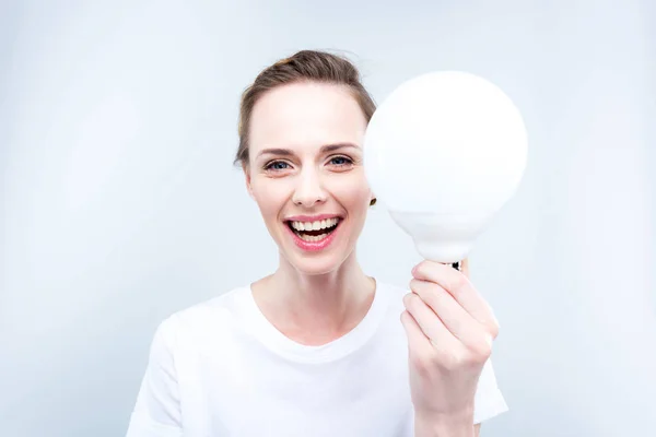 Lighting woman with light bulb — Stock Photo, Image