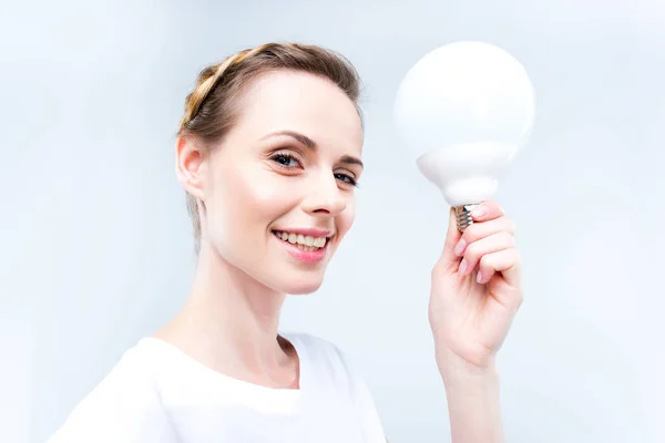 Woman with light bulb — Stock Photo, Image