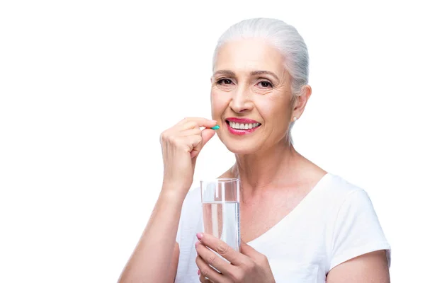 Senior woman with pill — Stock Photo, Image