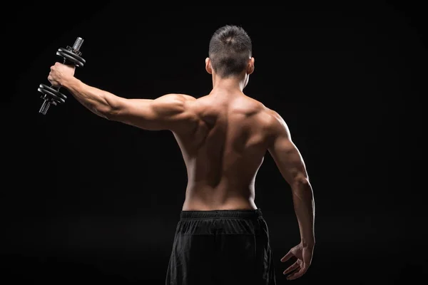 Muscular man with dumbbell — Stock Photo, Image