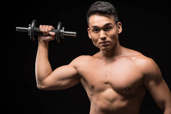 Muscular man with dumbbell — Free Stock Photo