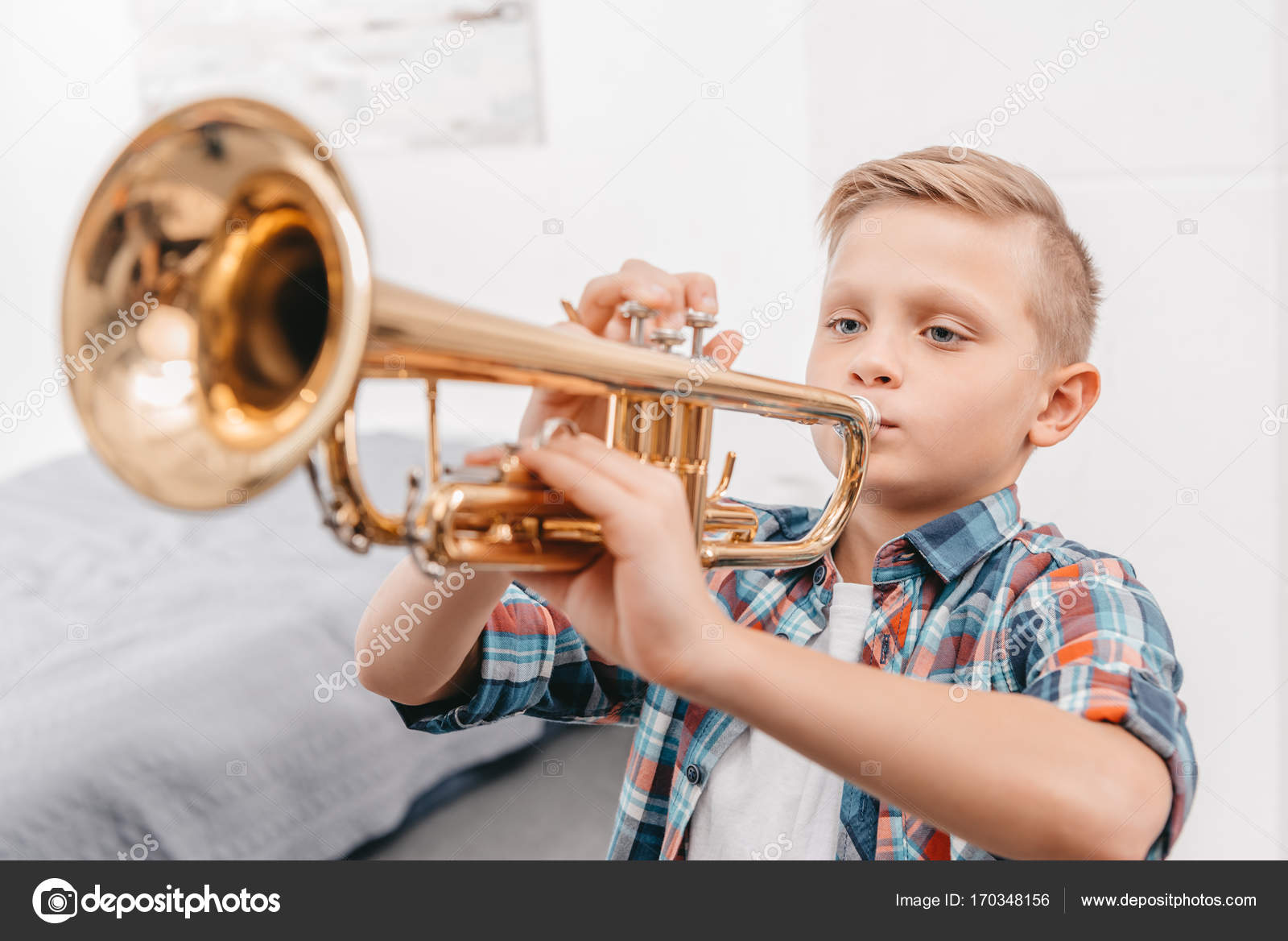 Talented boy playing the trumpet hi-res stock photography and images - Alamy