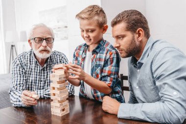 Family playing wood block game clipart