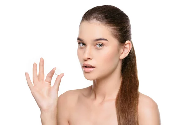 Woman holding white pill — Stock Photo, Image