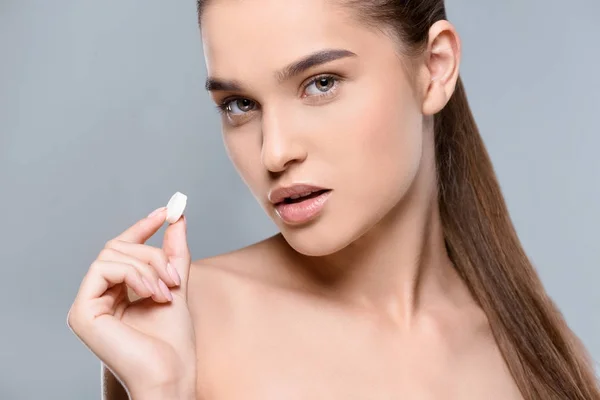 Woman holding white pill — Stock Photo, Image