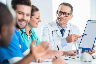 team of doctors having conversation clipart