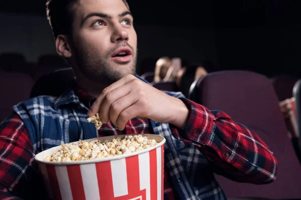 Young Handsome Man Eating Popcorn While Watching Movie Cinema — Stock Photo, Image