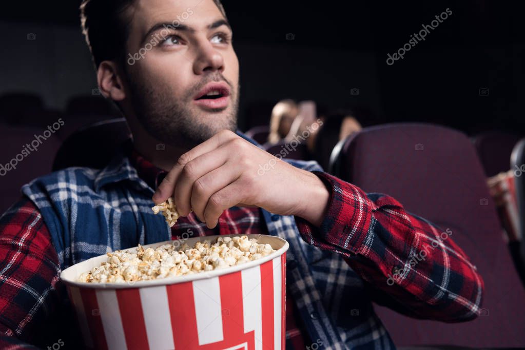 depositphotos_175955918-stock-photo-young-handsome-man-eating-popcorn.jpg