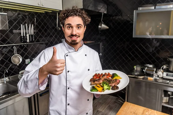 Smiling Chef Showing Thumb Holding Cooked Vegetables Meat — Stock Photo, Image