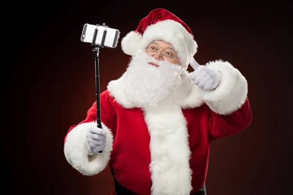 Papai Noel tirando selfie — Fotografia de Stock