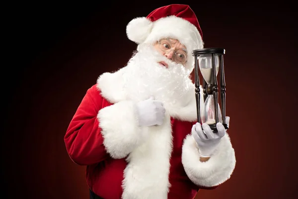 Santa Claus con reloj de arena - foto de stock