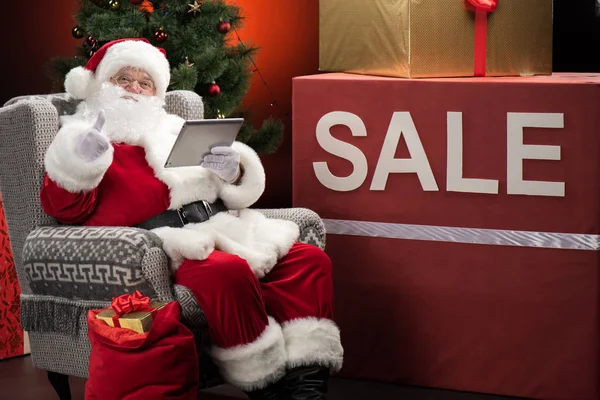 Santa Claus with Sale sign — Stock Photo