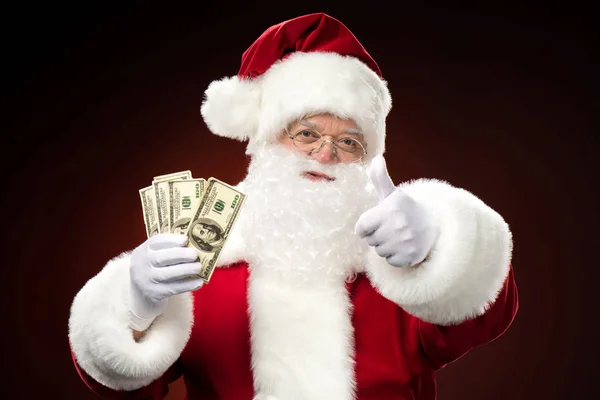 Santa Claus with dollars — Stock Photo