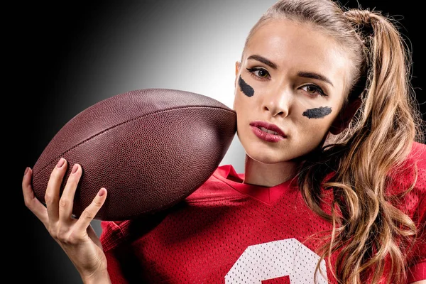 American football player holding ball — Stock Photo