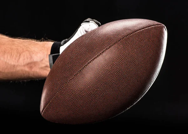 Football player holding ball — Stock Photo