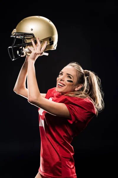 Female football player cheering with helmet — Stock Photo