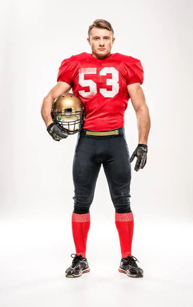 Jogador de futebol segurando capacete — Fotografia de Stock