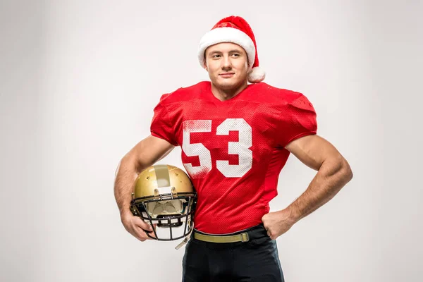 Football player in santa hat — Stock Photo