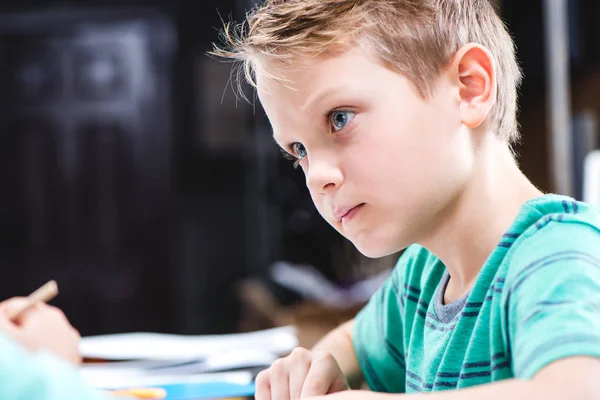 Concentrated schoolchild studying — Stock Photo