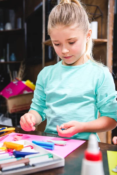 Kid playing with plasticine — Stock Photo