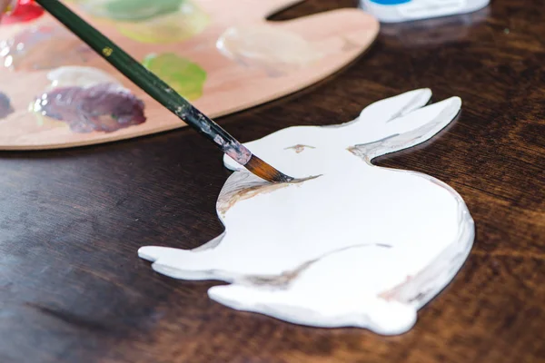 Child painting animal on paper — Stock Photo