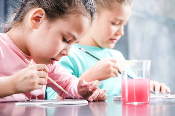Children painting on paper — Stock Photo