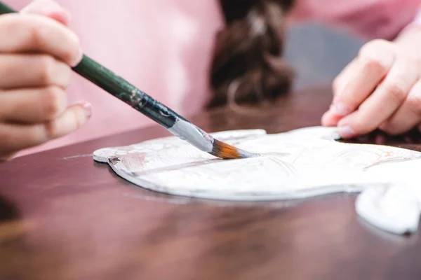 Child painting animal on paper — Stock Photo